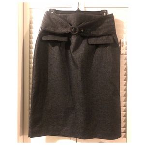 Black and gray shirt with back zipper and belt.